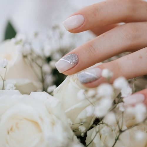 bride-demonstrates-her-manicure-wedding-bouquet